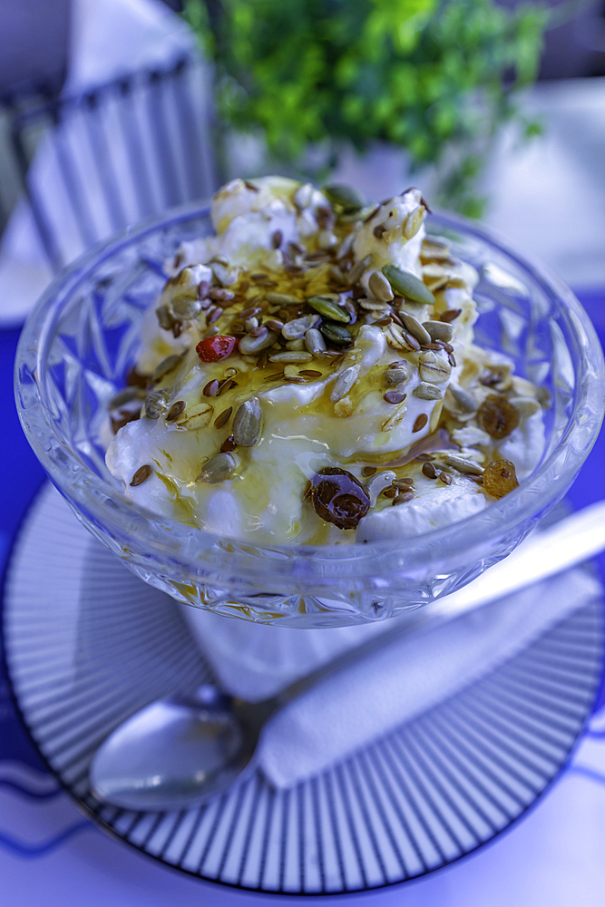 View of traditional Greek yoghurt and fruit salad, City of Heraklion, Crete, Greek Islands, Geece, Europe
