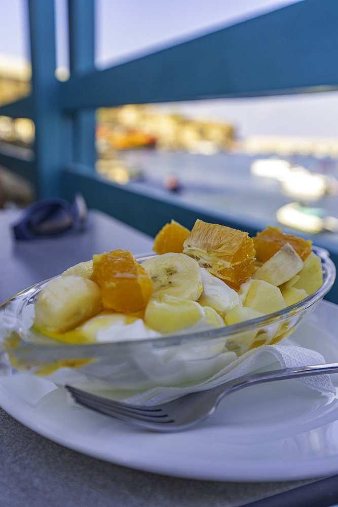 View of traditional Greek yoghurt fruit salad in Limenas Chersonisou, Crete, Greek Islands, Greece, Europe