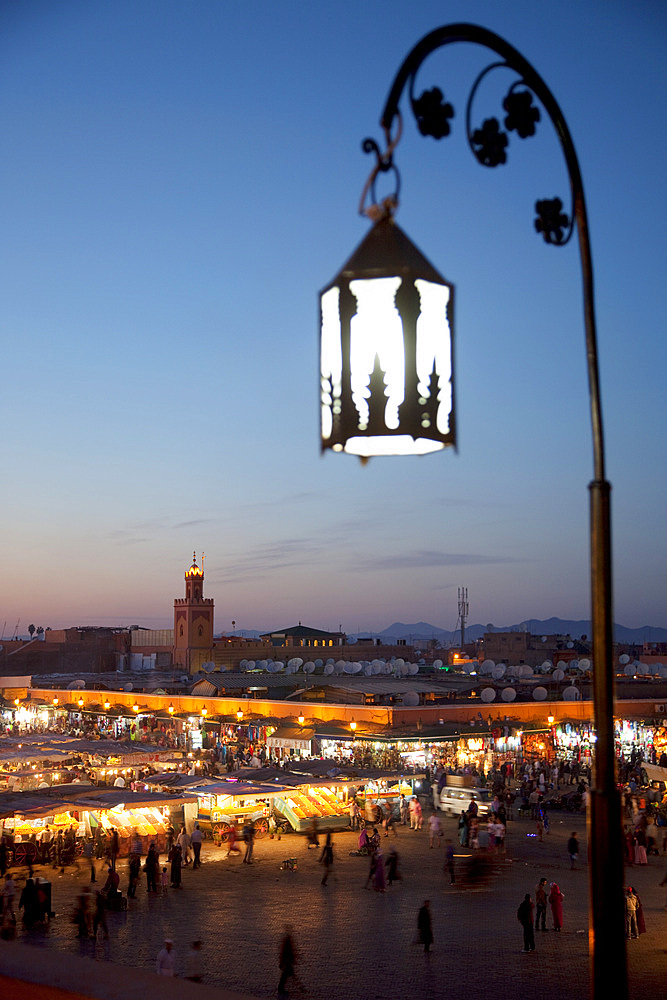 View over market square at dusk, Place Jemaa El Fna, Marrakesh, Morocco, North Africa, Africa