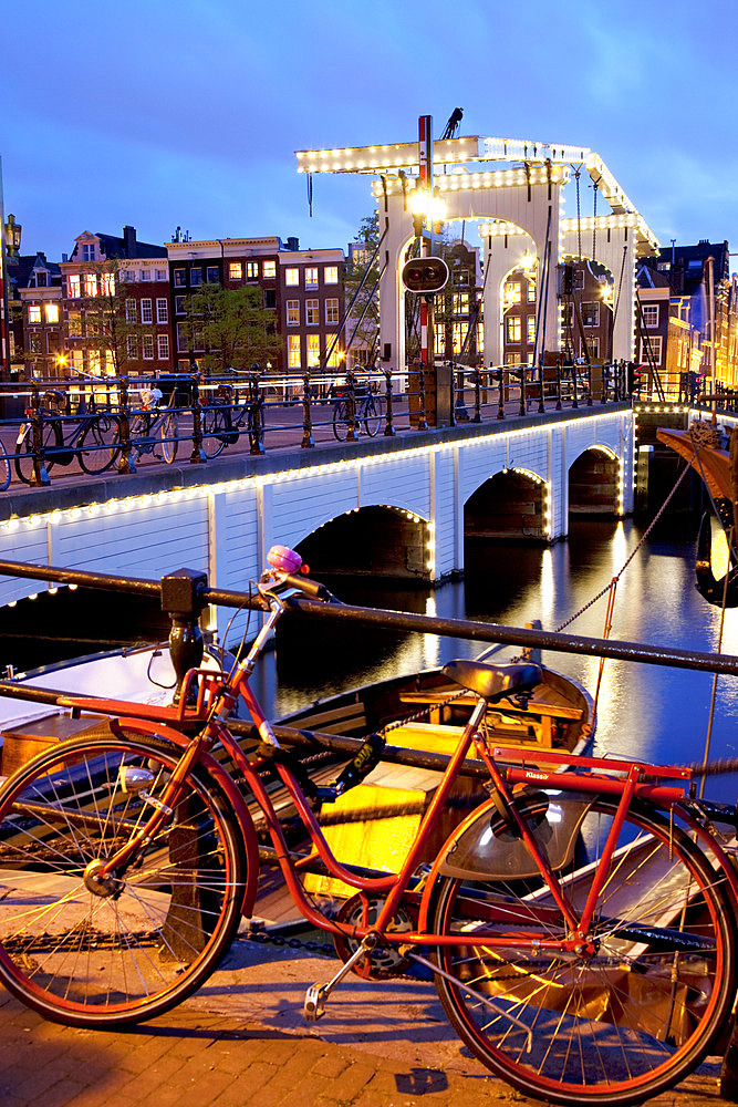 Magere Brug (Skinny Bridge) at dusk, Amsterdam, Holland, Europe