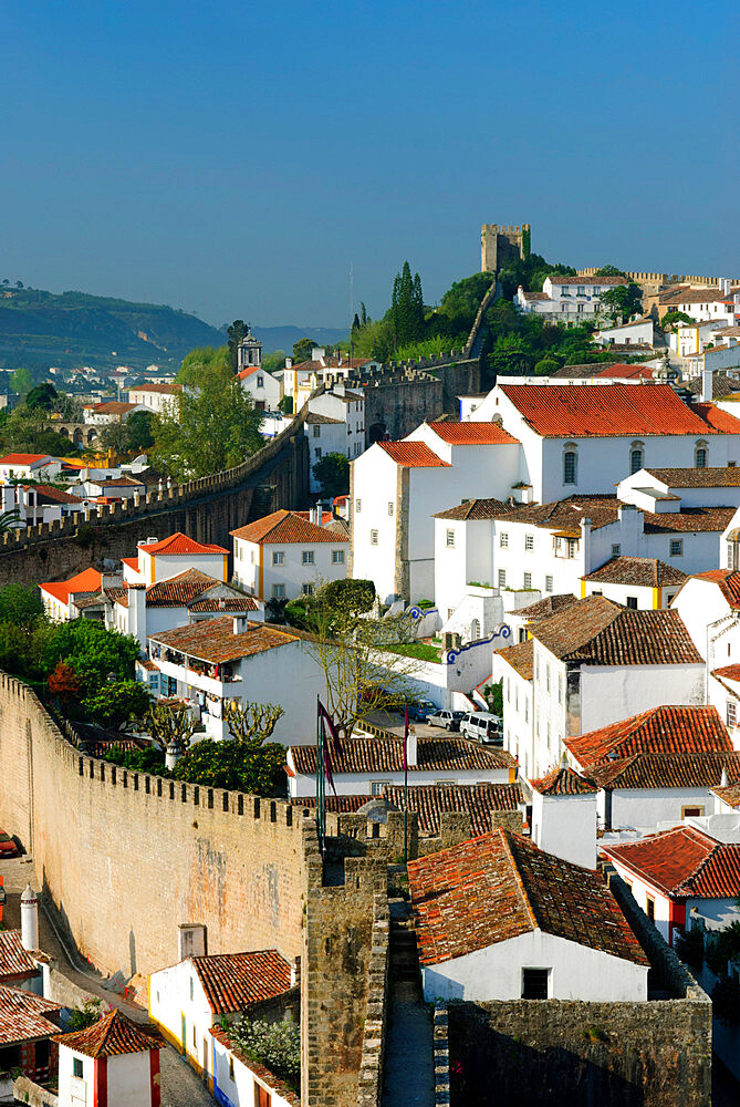 View of old town and castle walls, Obidos, Estremadura, Portugal, Europe