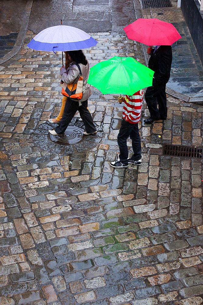 Rain on cobbled street, Seville, Andalucia, Spain, Europe