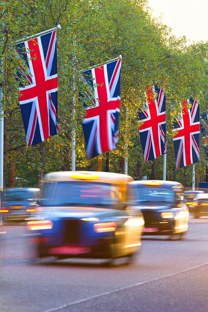 Black cabs along The Mall with Union Jack flags, London, England, United Kingdom, Europe