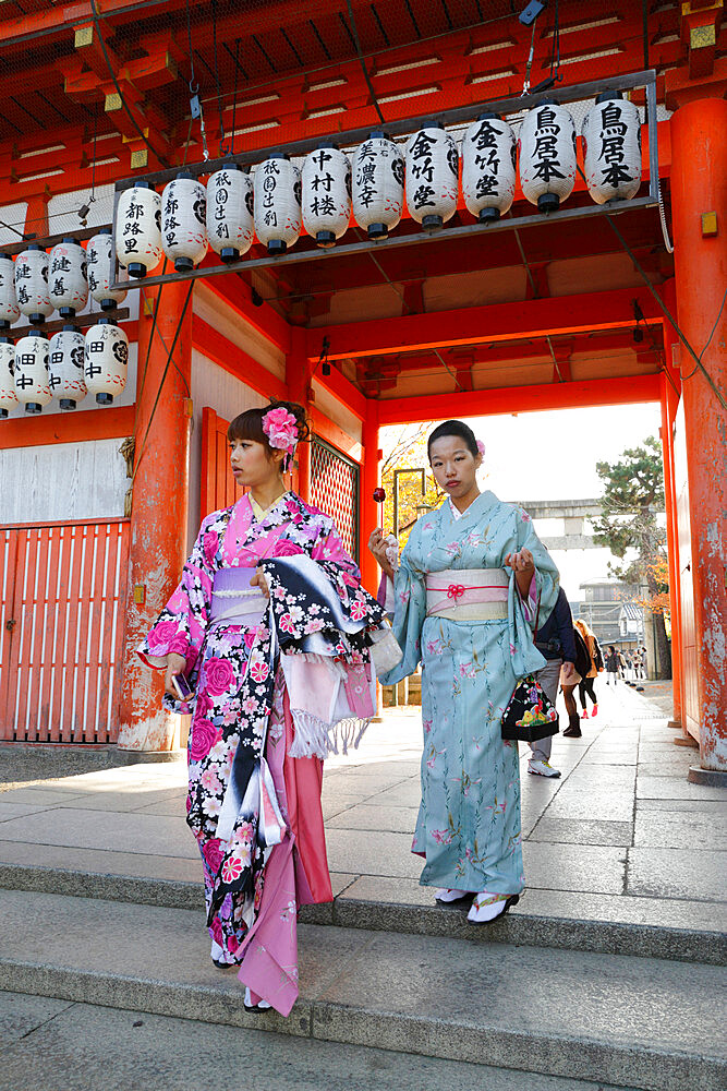 Young Japanese girls in traditional kimonos, Yasaka Shrine, Kyoto, Japan, Asia