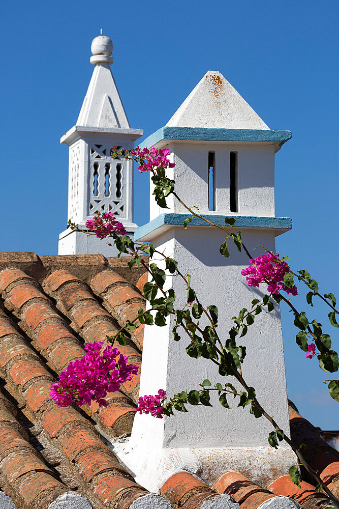 Filigreed chimney pots and Bougainvillea, Algarve, Portugal, Europe