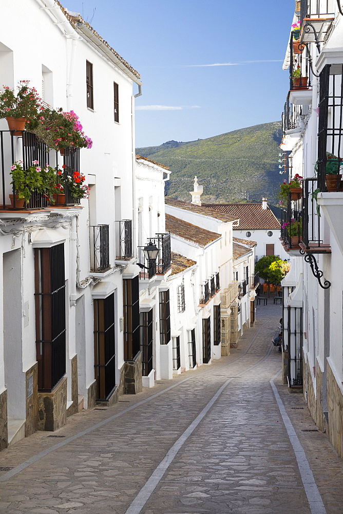 Narrow street in Andalucian white village, Zahara de la Sierra, Sierra de Grazalema Natural Park, Andalucia, Spain, Europe