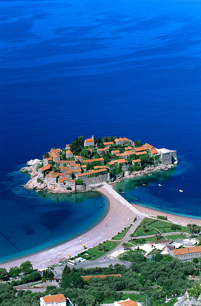 Aerial view over island and sandbar, Sveti Stefan, The Budva Riviera, Montenegro, Europe