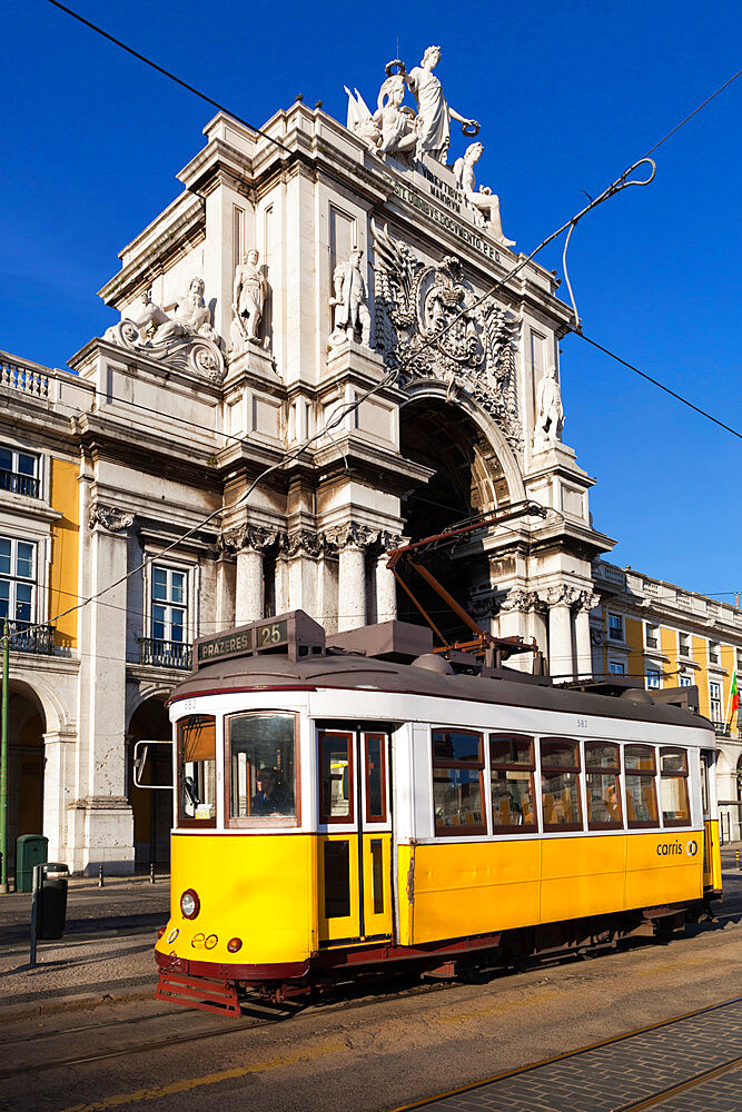 Tram (electricos) below the Arco da Rua Augusta in Praca do Comercio, Baixa, Lisbon, Portugal, Europe