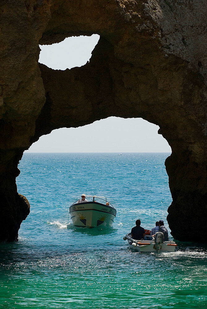 Tourist boats amongst rock formations, Ponta da Piedade, Lagos, Algarve, Portugal, Europe