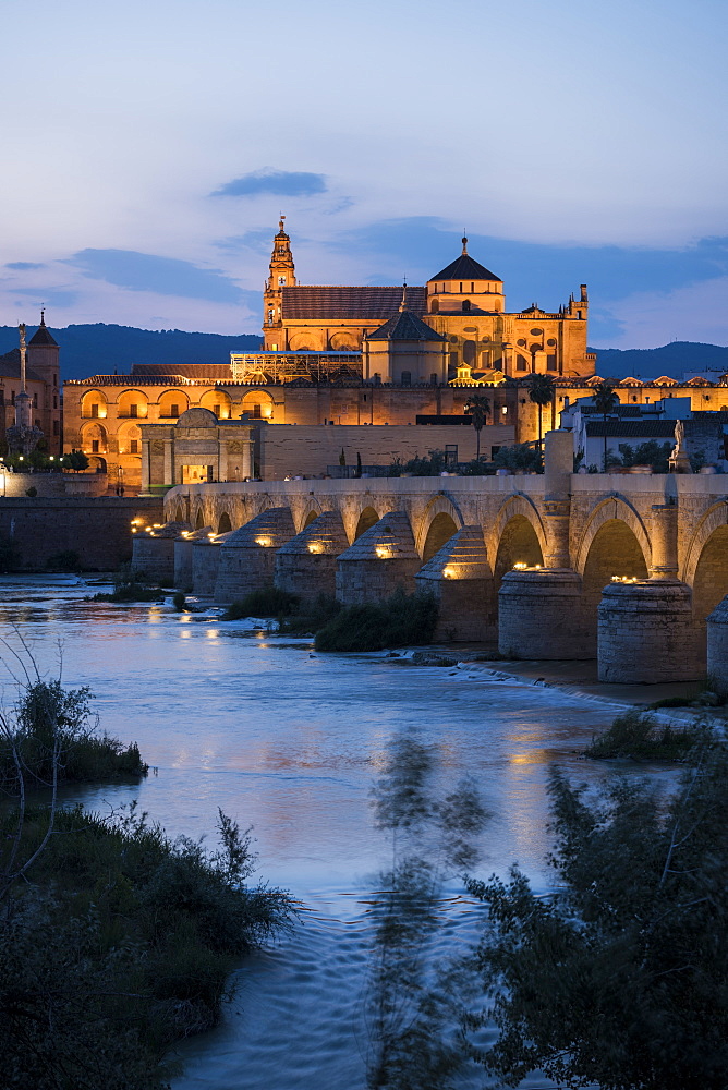 The Cathedral and Great Mosque of Cordoba (Mezquita) and Roman Bridge at twilight, UNESCO World Heritage Site, Cordoba, Andalucia, Spain, Europe