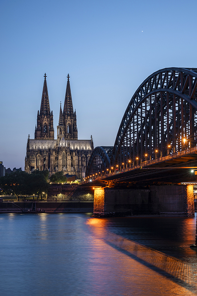 Cologne Cathedral, UNESCO World Heritage Site, and Hohenzollern Bridge at dusk, Cologne, North Rhine-Westphalia, Germany, Europe