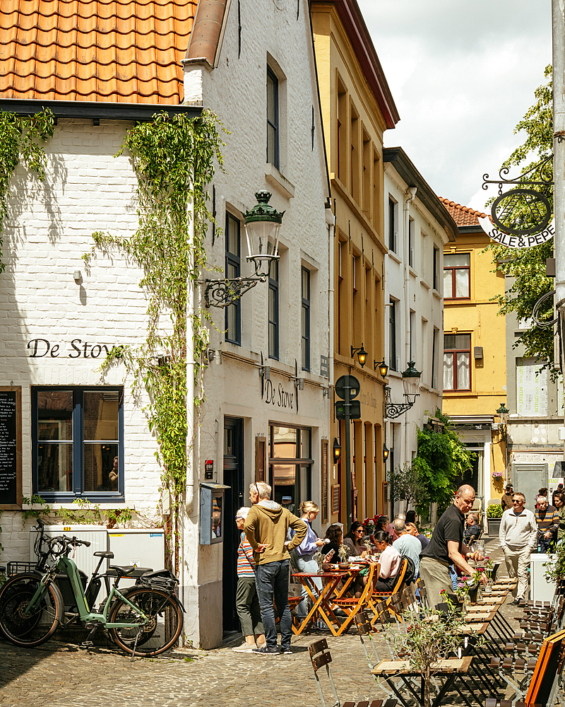 Restaurant with people dining outdoors, Bruges, Belgium