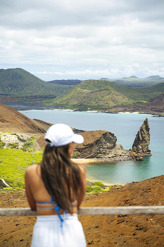 Tourist enjoying view, Isla Bartholomé, Galapagos Islands, Ecuador