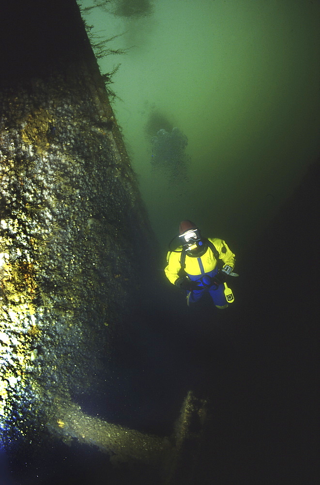 Diver alongside German Light Cruiser Dresden II, Scapa Flow, Orkney islands, Scotland, UK