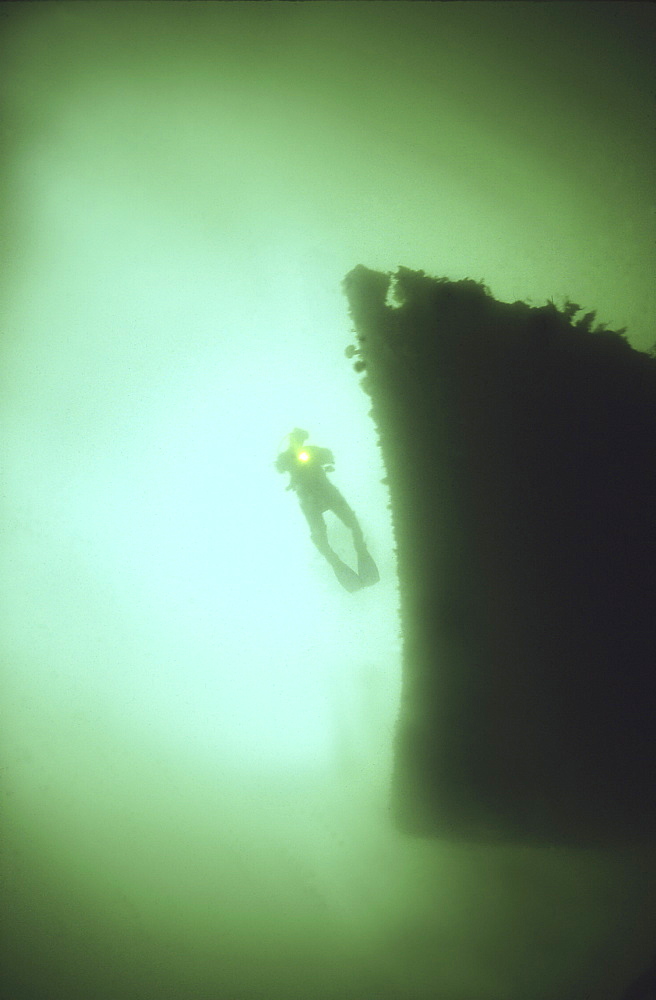 Diver on bows of German Light Cruiser Coln II, Scapa Flow, Orkney islands, Scotland, UK