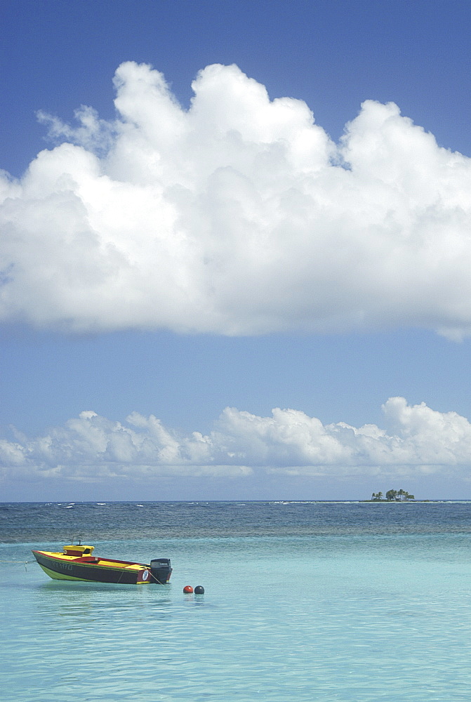 Small boat and blue sea, Rurutu, French Polynesia.