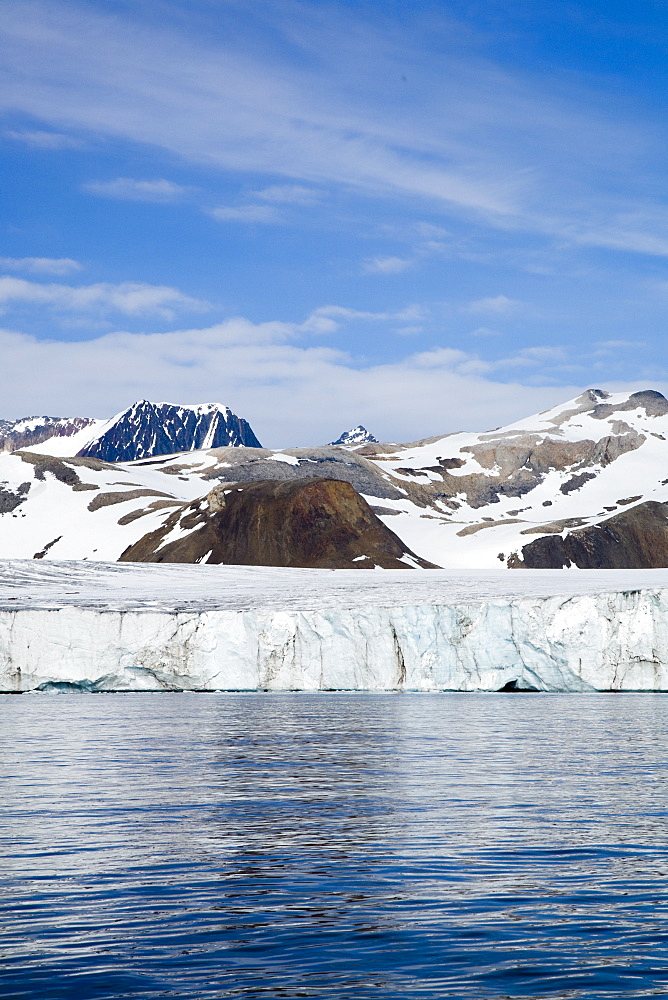 A view of the tidewater glacier in Isbukta (Ice Bay) on the western side of Spitsbergen Island in the Svalbard Archipelago, Barents Sea, Norway