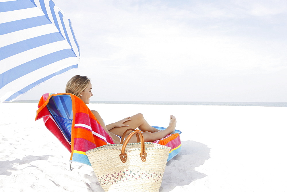 Teenage girl relaxing on beach