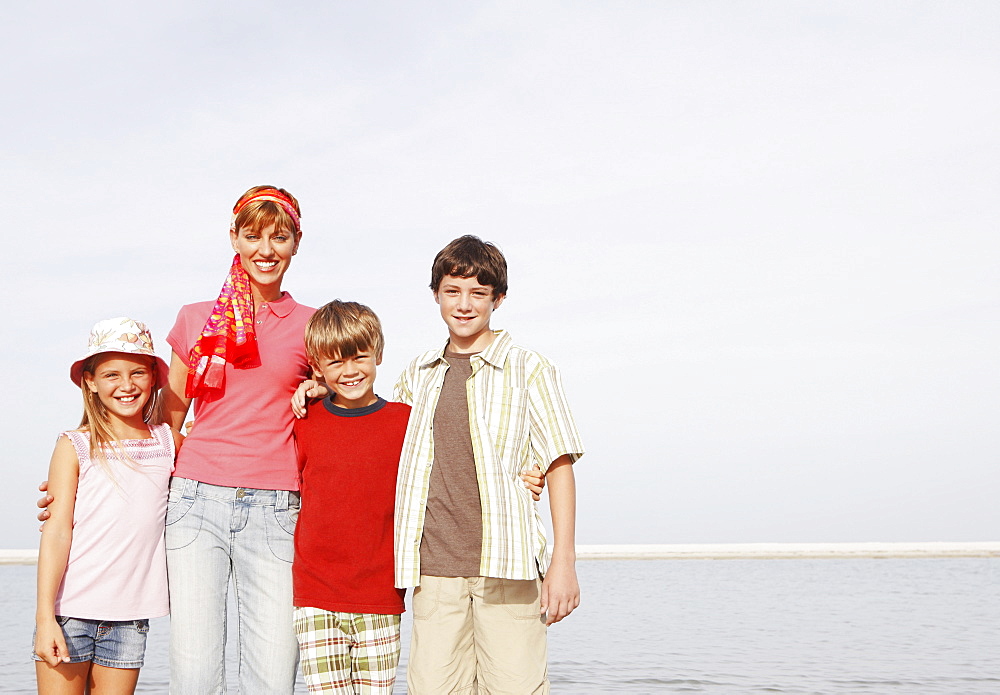 Family posing on beach