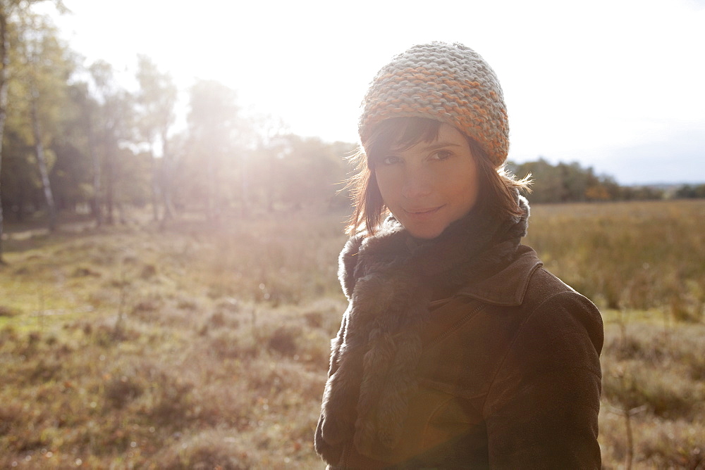 Netherlands, Utrechtse Heuvelrug, Portrait of young woman in winter countryside, Netherlands, Utrechtse Heuvelrug
