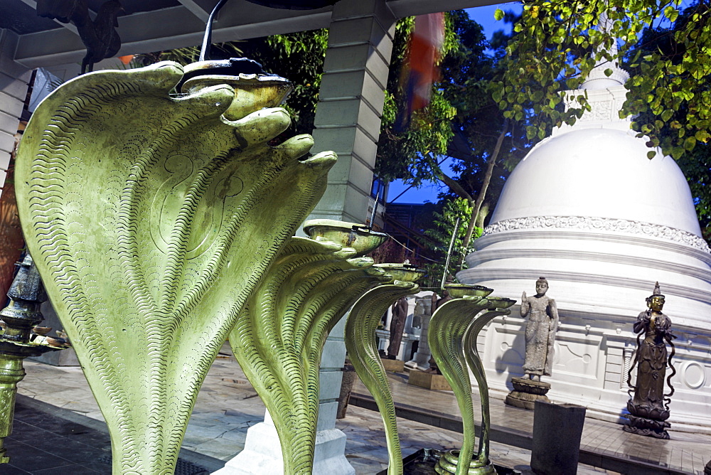 Cobra statues in front of stupa in Gangaramaya Temple area, Colombo, Sri Lanka