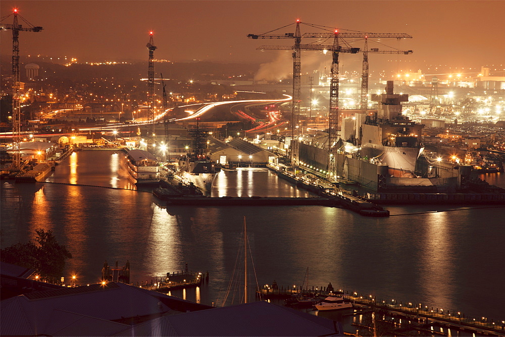 Cityscape with cranes at night, Norfolk, Virginia