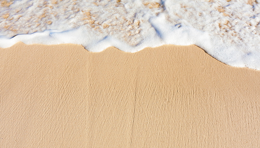 Sea waves on beach sand