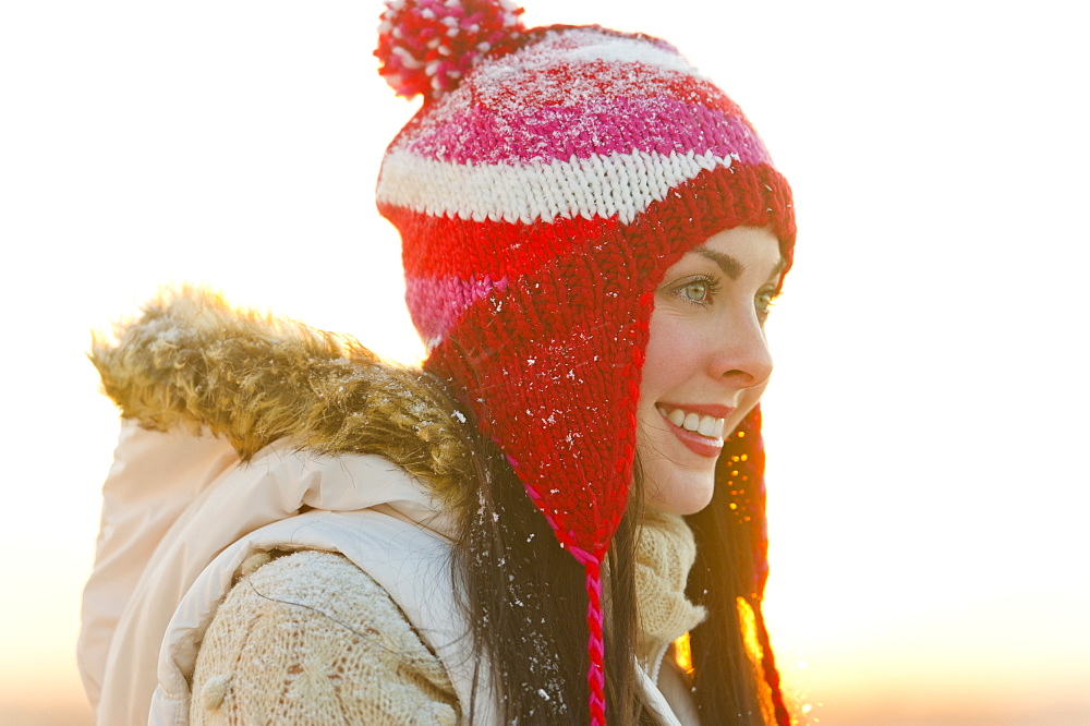 Portrait of young woman wearing knit hat