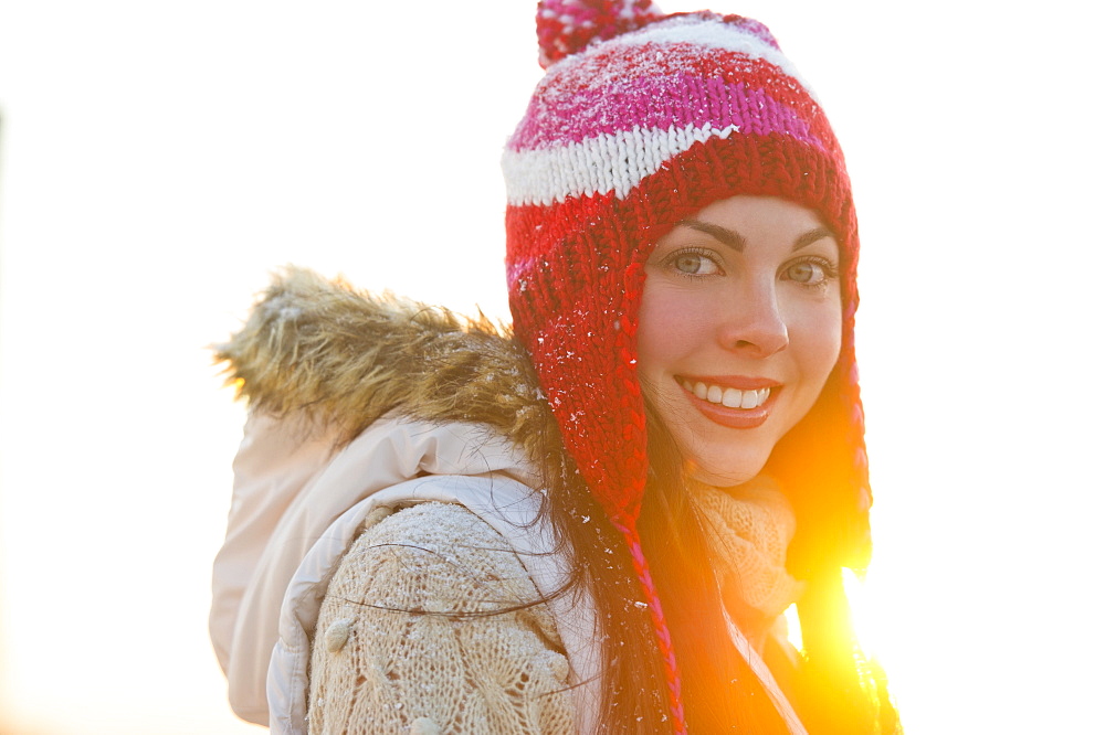 Portrait of young woman wearing knit hat