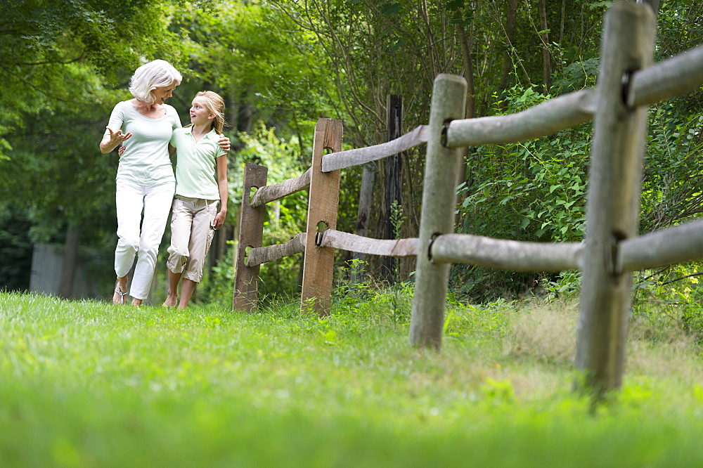 Girl (10-11) and grandmother walking together