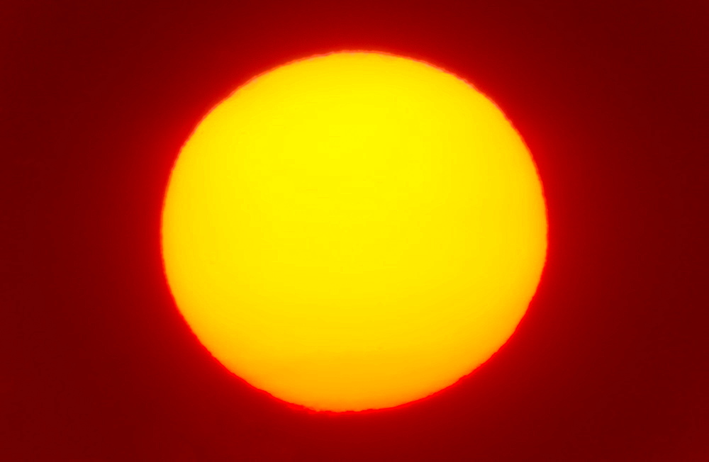 Close-up of large red sun