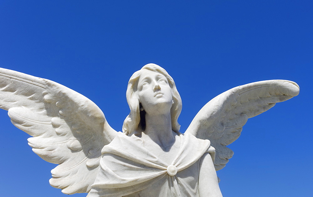 Puerto Rico, Old San Juan, Santa Maria Magdalena Cemetery, Close-up view of praying angel statue