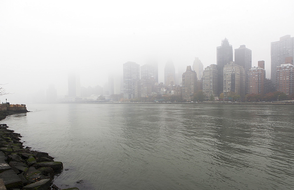 View of city over river, USA, New York State, New York City