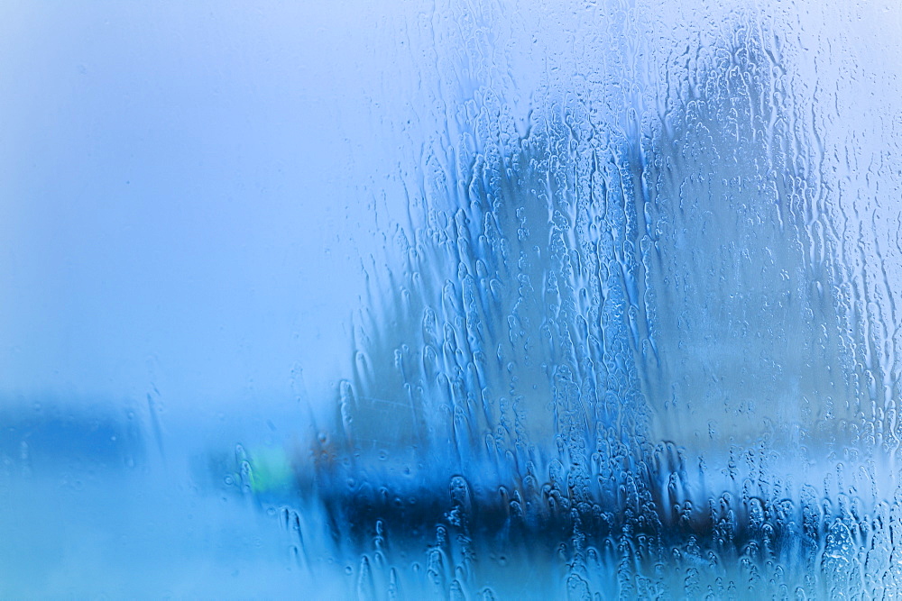 Schooner seen through wet window, Portland, Maine