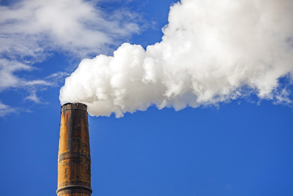 Low angle view of smoke coming out of chimney