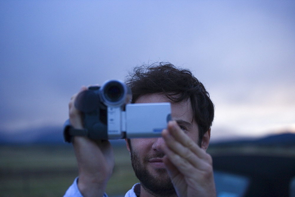 Man using video camera