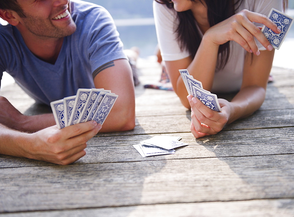 Roaring Brook Lake, Couple playing cards on pier