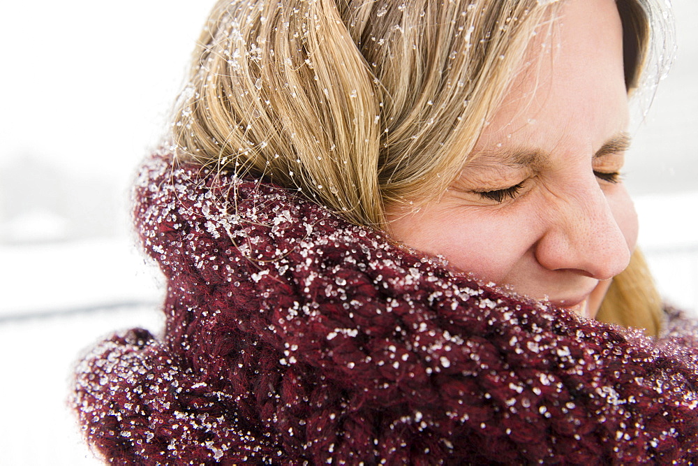 Portrait of woman wearing wooly scarf