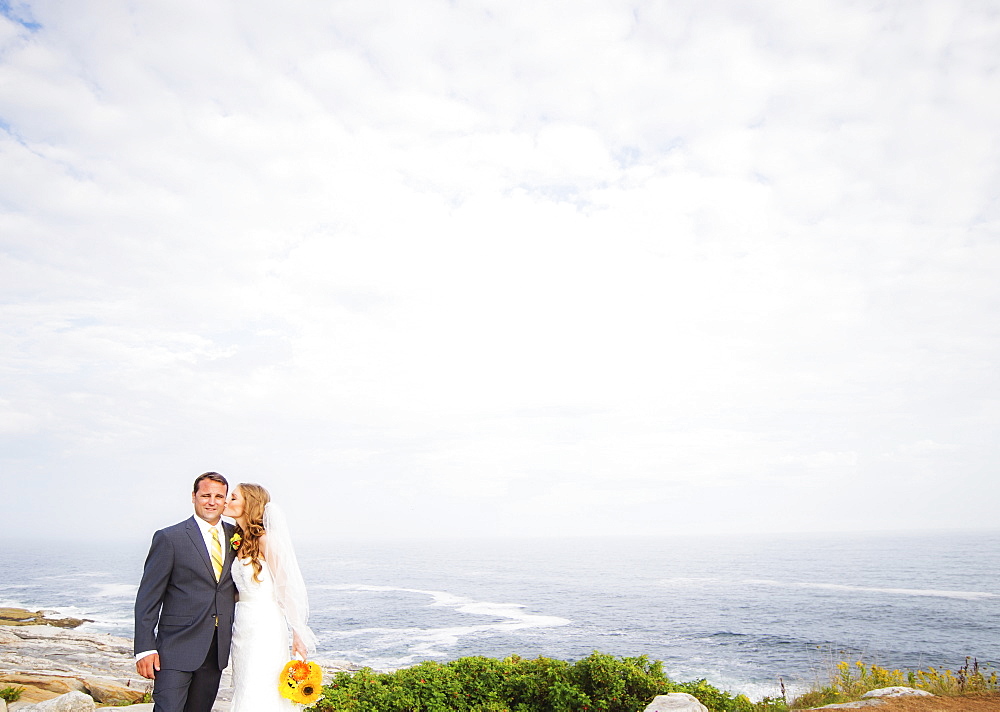 Portrait of married couple, woman kissing man, USA, Maine, Bristol 