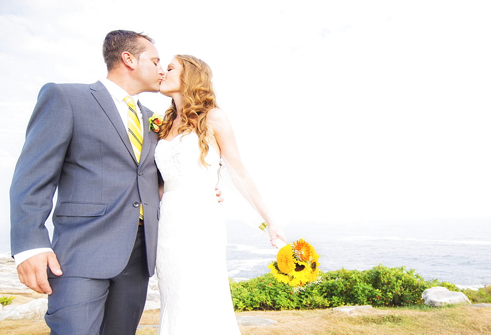 Portrait of married couple kissing, USA, Maine, Bristol 