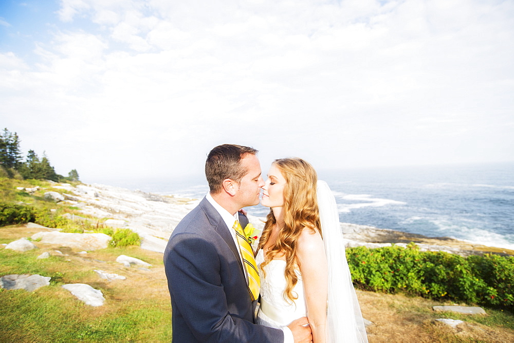 Portrait of married couple kissing, USA, Maine, Bristol 