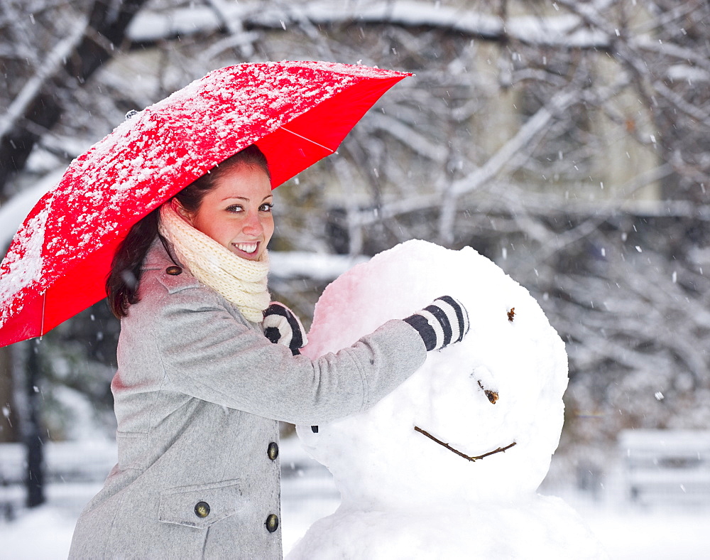 Woman making a snowman