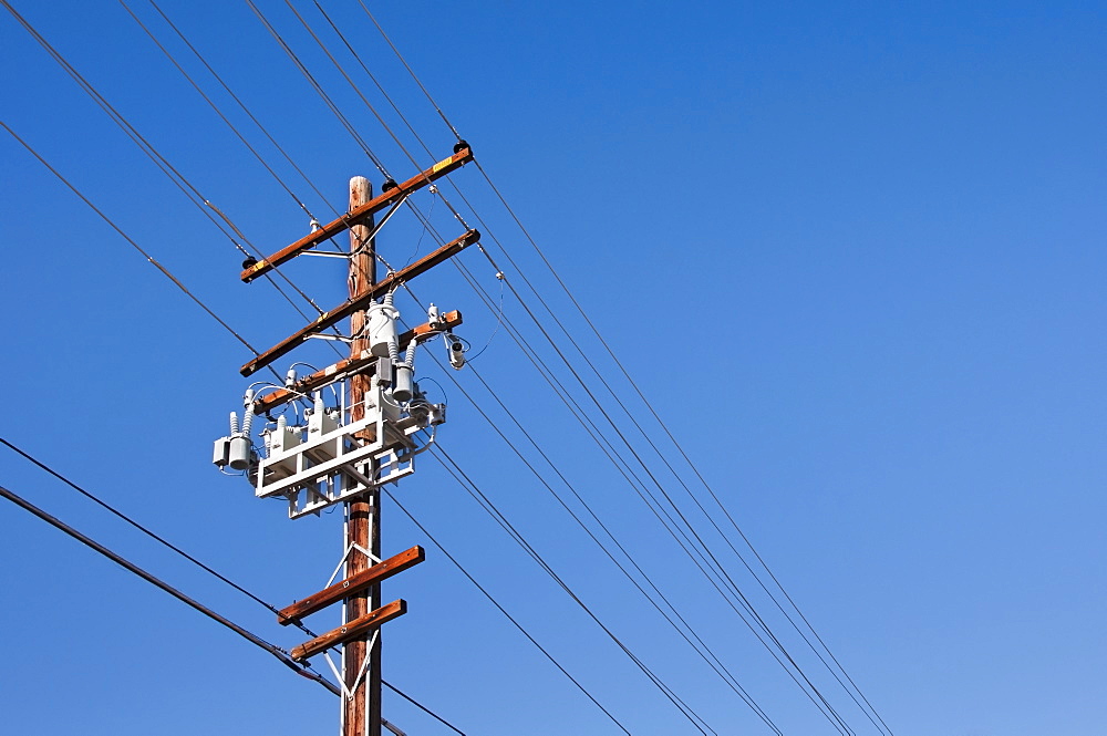 Power line against blue sky