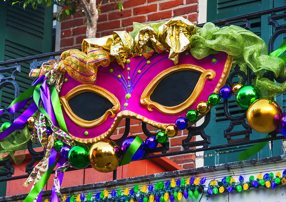 Mardi Gras mask hanging on balcony's railing, USA, Louisiana, New Orleans