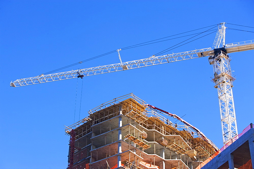 Low angle view of construction site and crane