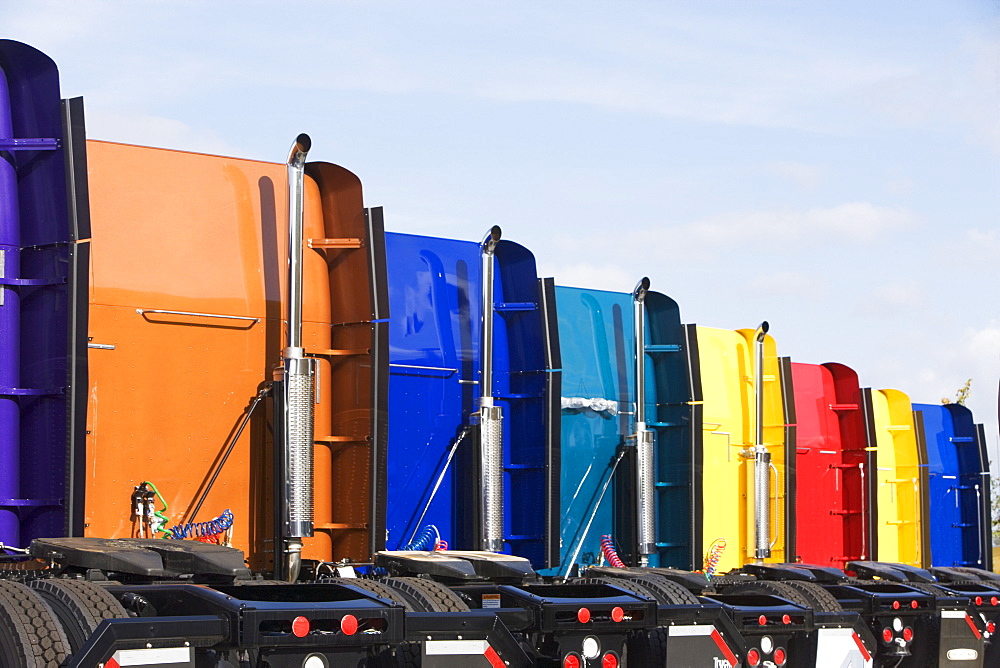 Rear view of row of tractor trailer cabs