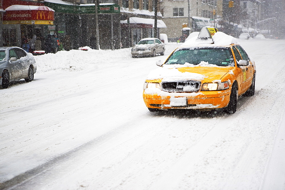 Taxi cab in snow, New York City