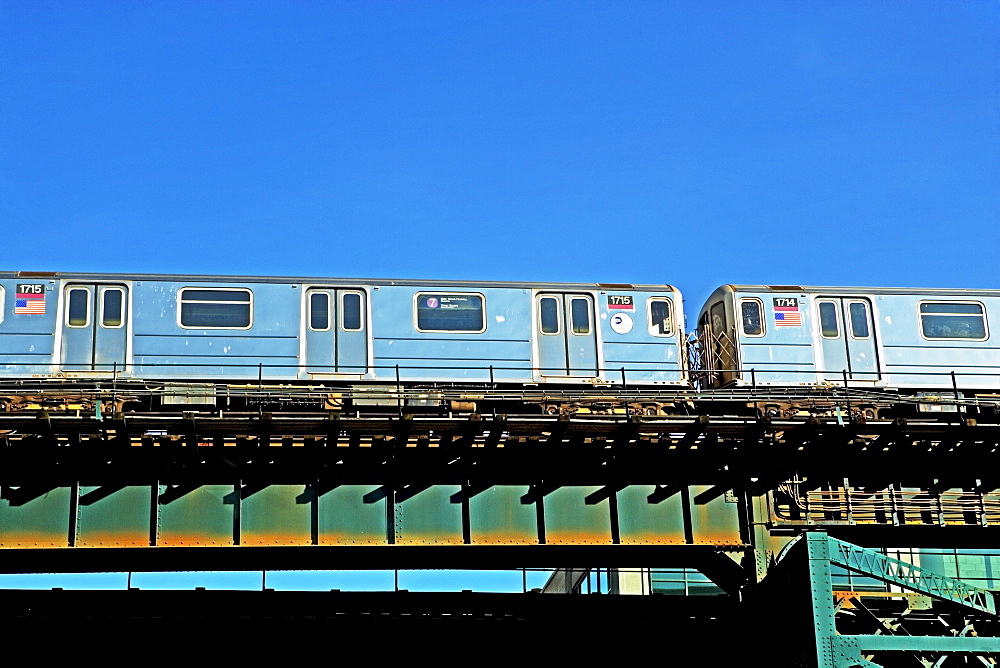 Elevated train under blue sky