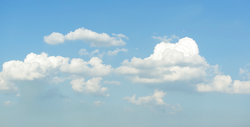 Puffy clouds on blue sky