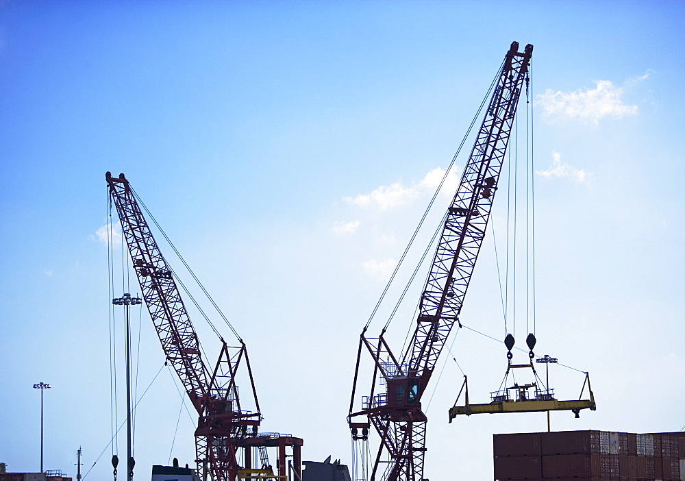 Cranes moving shipping containers